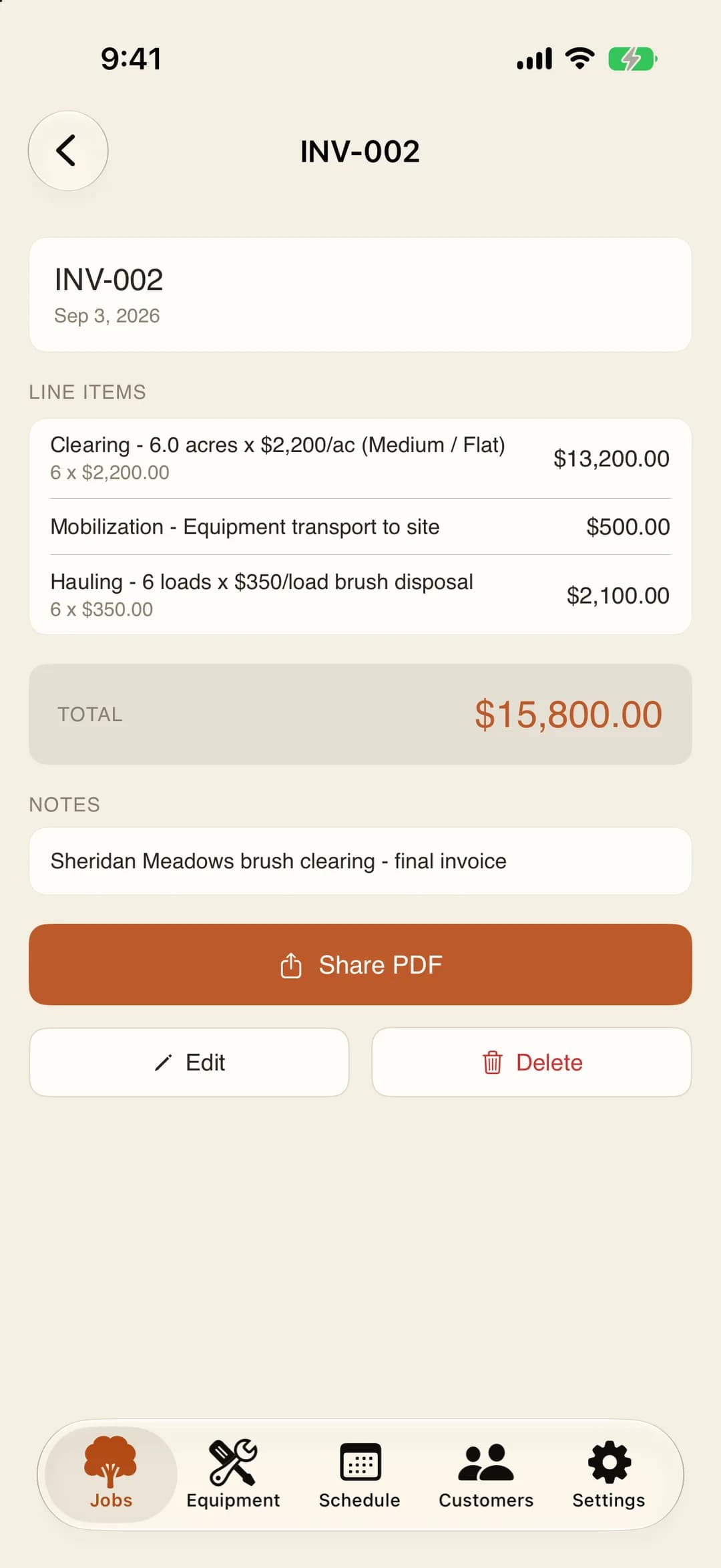 MulchDeck invoice on iPhone: line items from the estimate, the total, and a Share PDF button